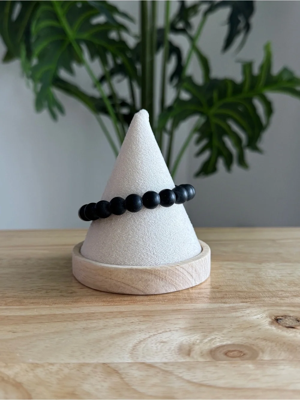 Matte Black Beaded Stretch Bracelet with Gold Charm